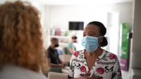 Female patient speaks with doctor